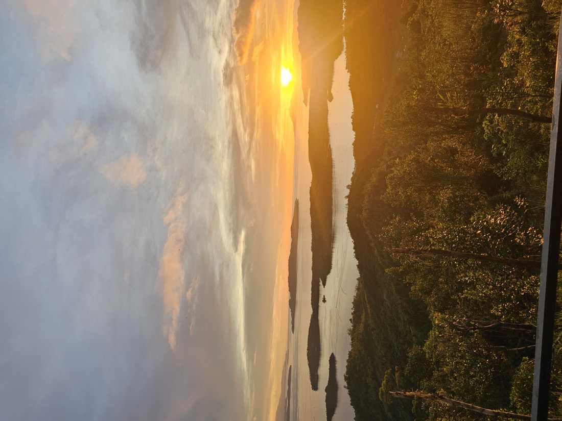 The sun setting over the Dinagat Islands, seen from Laaganan